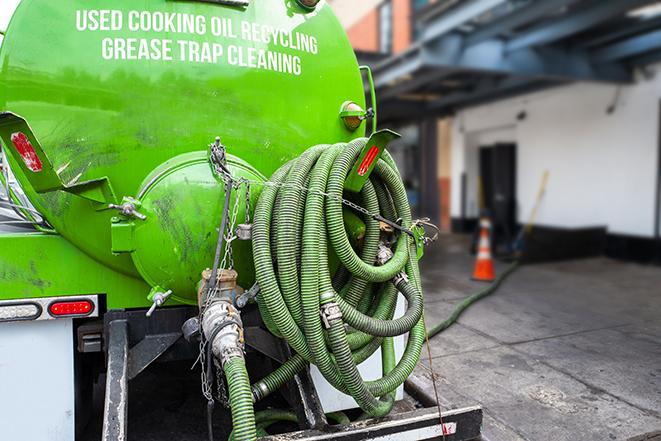 septic tank pump truck in operation in Centreville